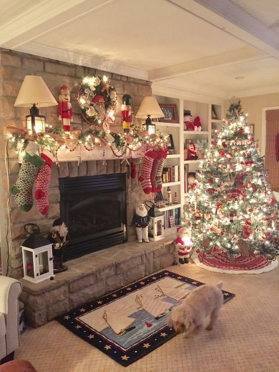 Cozy living room filled with Christmas decorations, including stockings, a decorated tree, nutcrackers, and warm lighting by the fireplace.